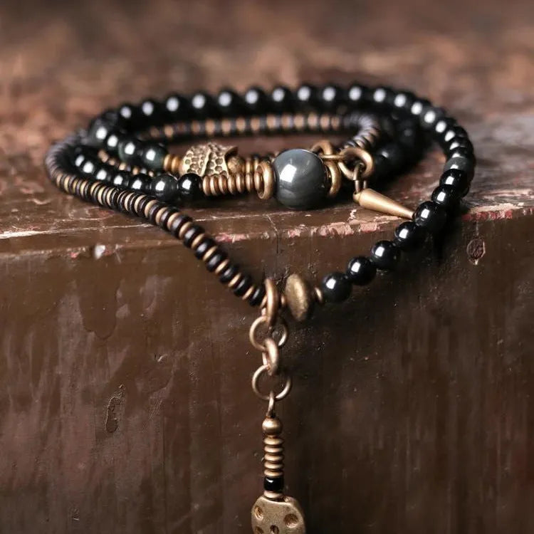 Geometric black beaded multi layered bracelet with natural styling elements