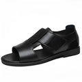 Men's black and brown leather casual sandals with open toe and rubber sole on a neutral background.