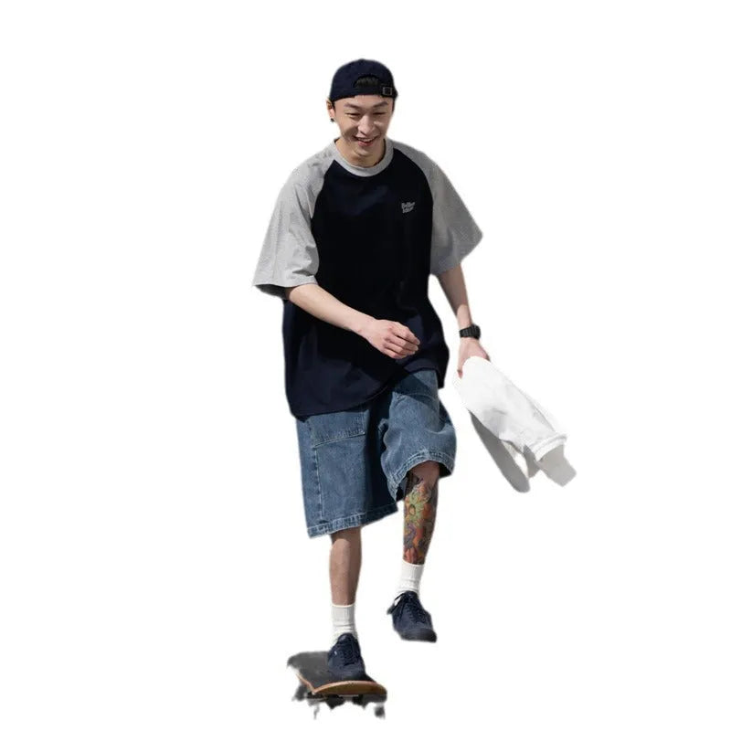 Men's loose blue raglan sleeve T-shirt made from thin polyester blend fabric.
