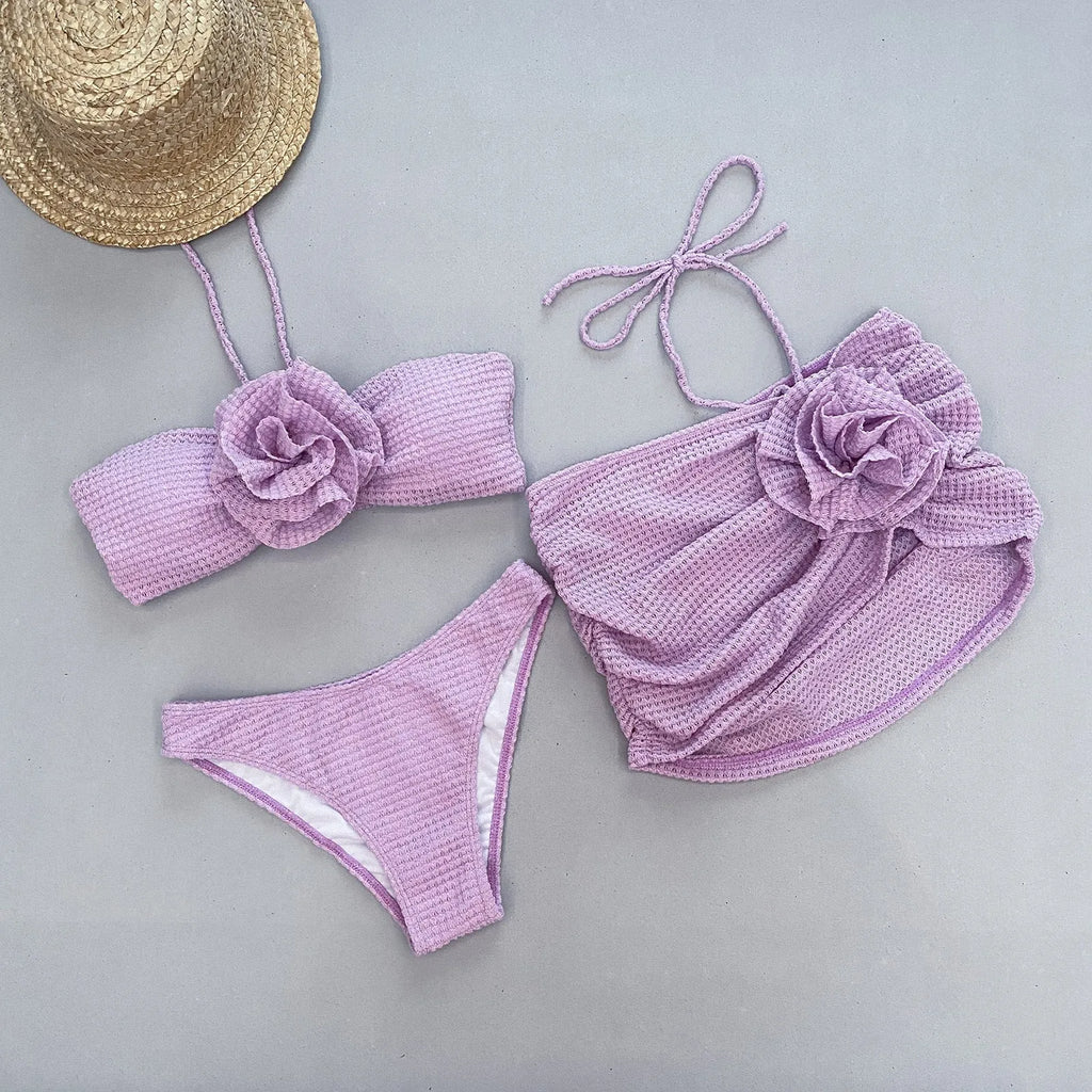 Women's three-piece bikini set with 3D flower split design in purple and white colour options