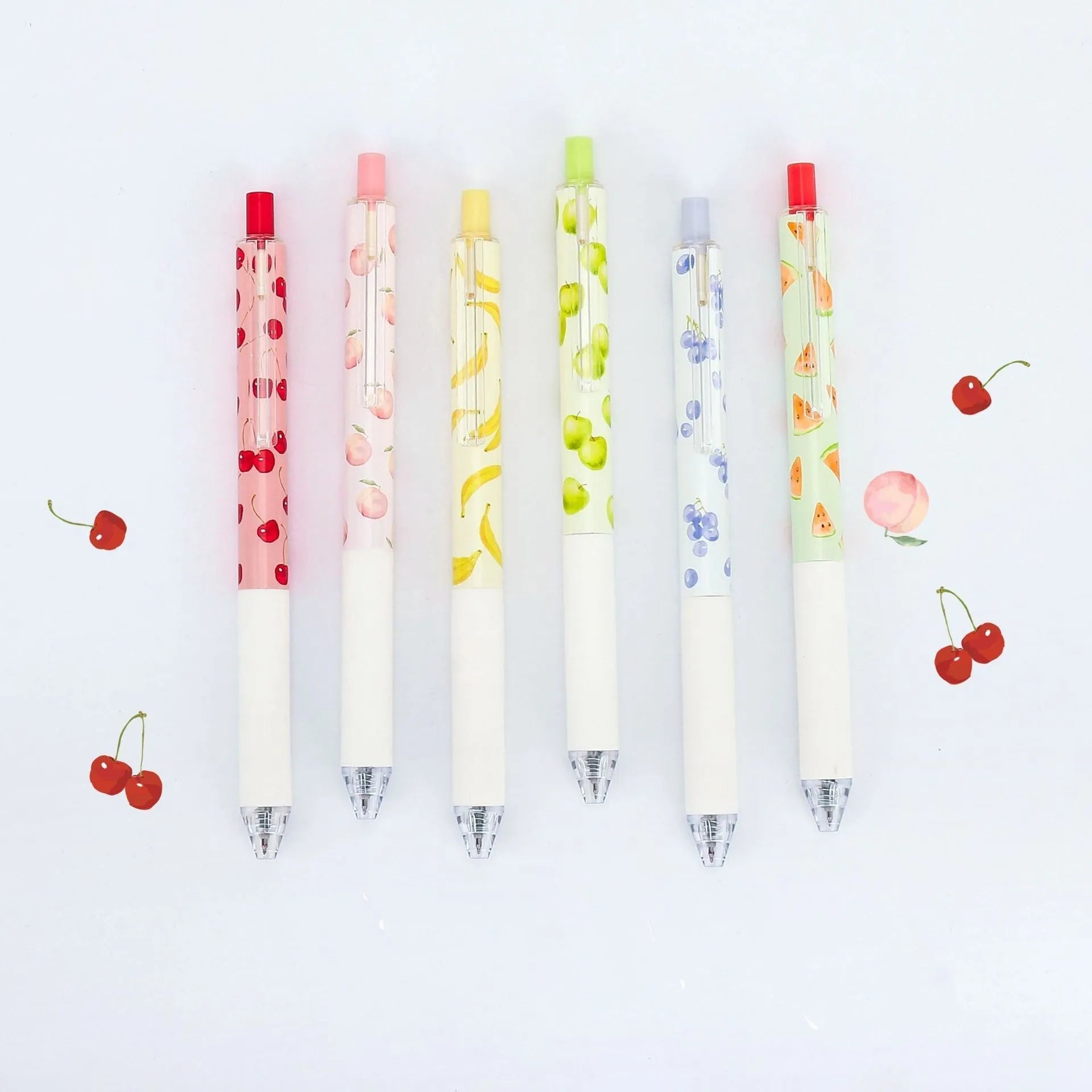 Three fruit scented press-action pens with 0.5mm black refills