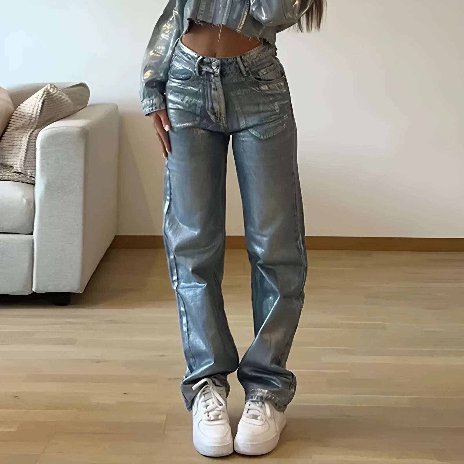 Blue high-waisted straight-leg jeans with washed denim finish on streetwear background