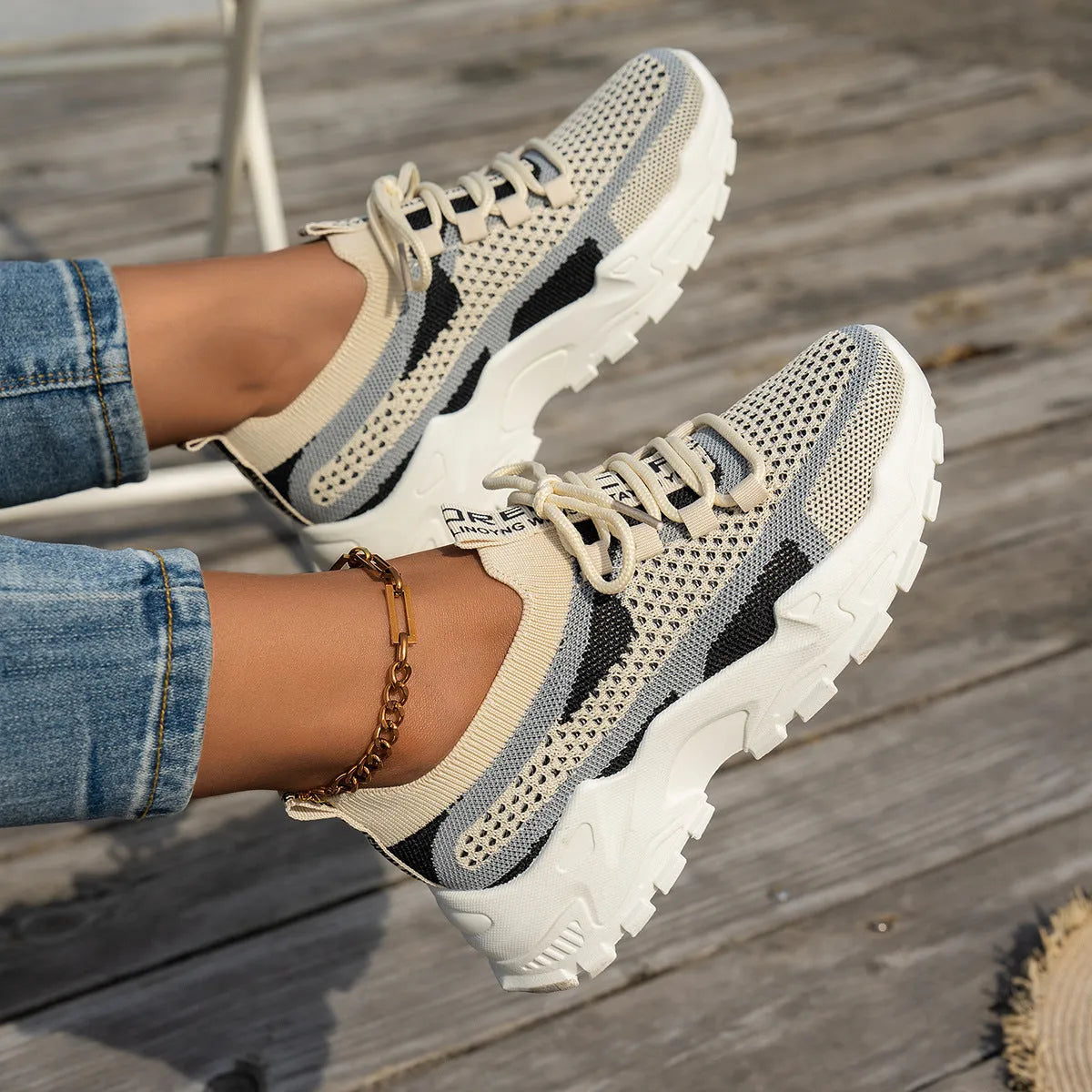 Women's Flyknit mesh lace-up sneakers in various colours with low flat heel and rubber sole