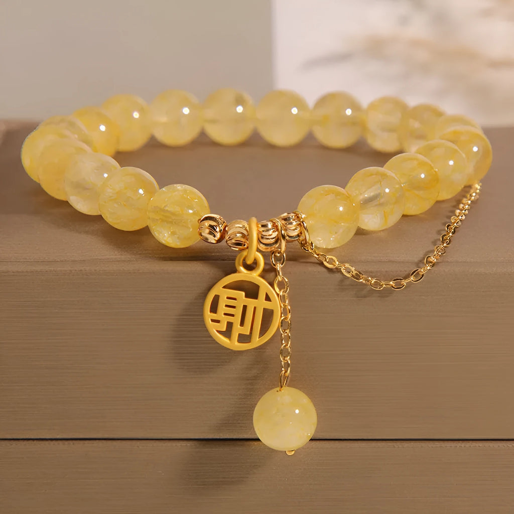 Natural citrine bracelet with Chinese character design and tassel detail