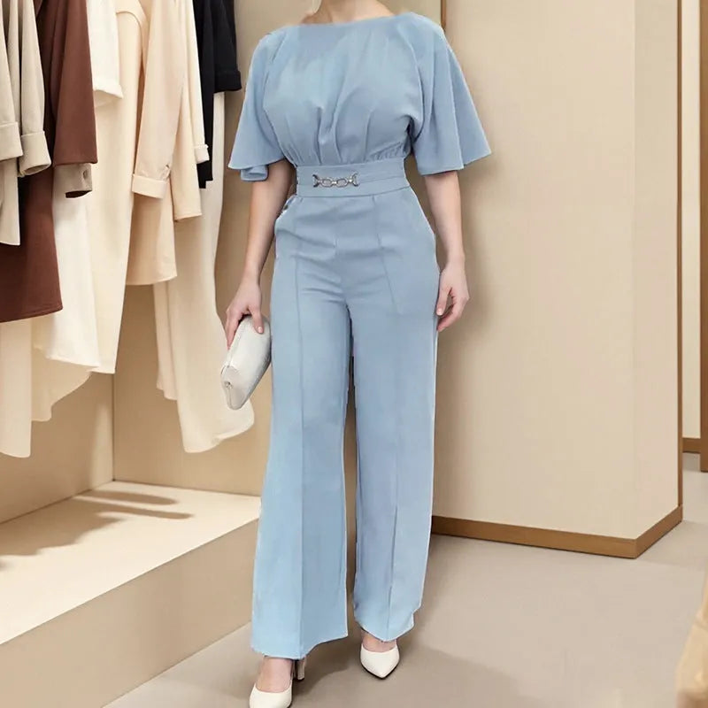 Blue men's two-piece casual suit with long sleeves and trousers on a model