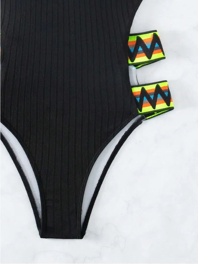 Women's solid colour one-piece bikini swimsuit in black or orange polyester fabric
