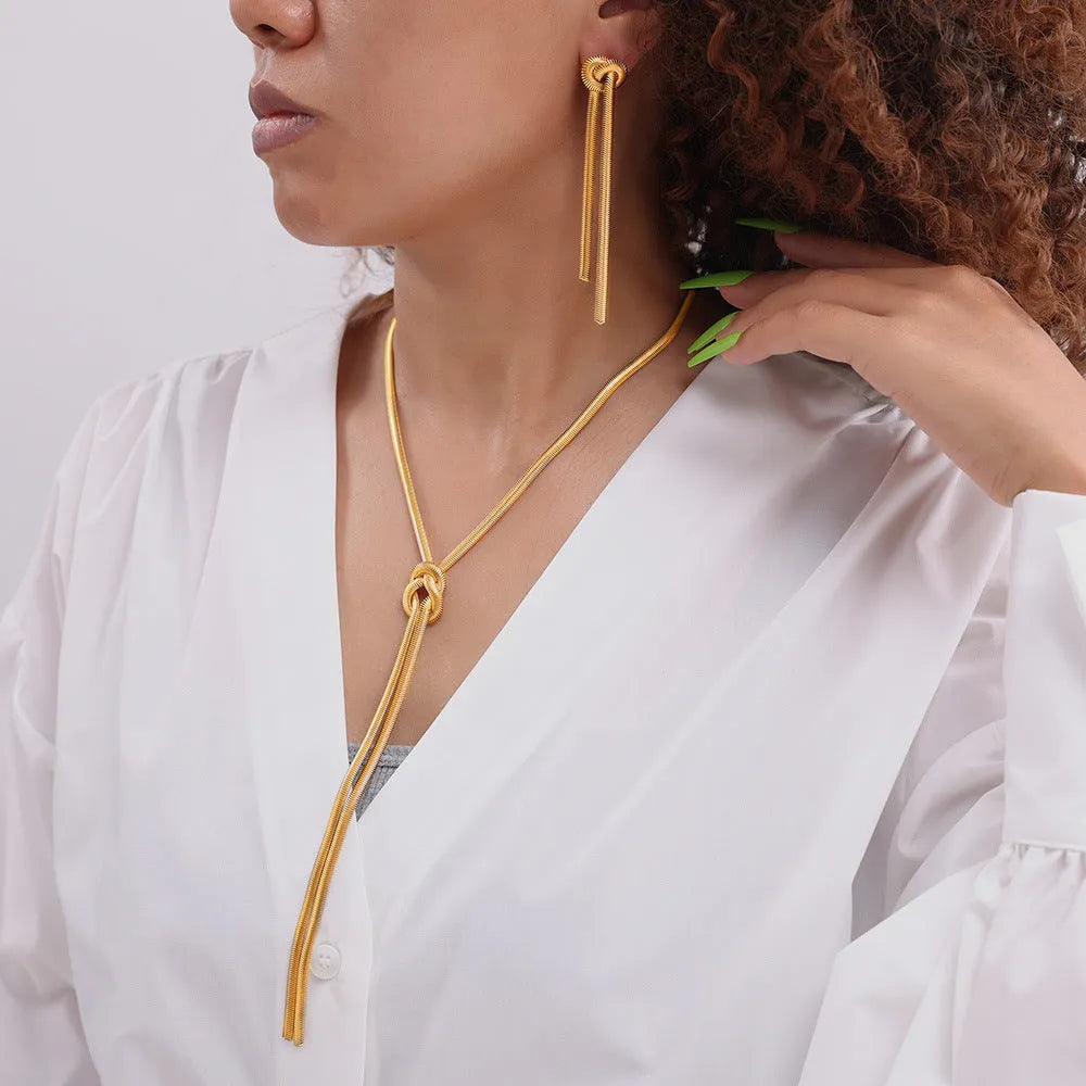 Gold electroplated titanium steel necklace with snake chain and tassel pendant with matching earrings jewellery set