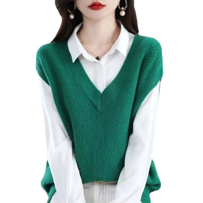 Women's creamy-white V-neck sleeveless knitted vest with a raised 3D pattern texture.