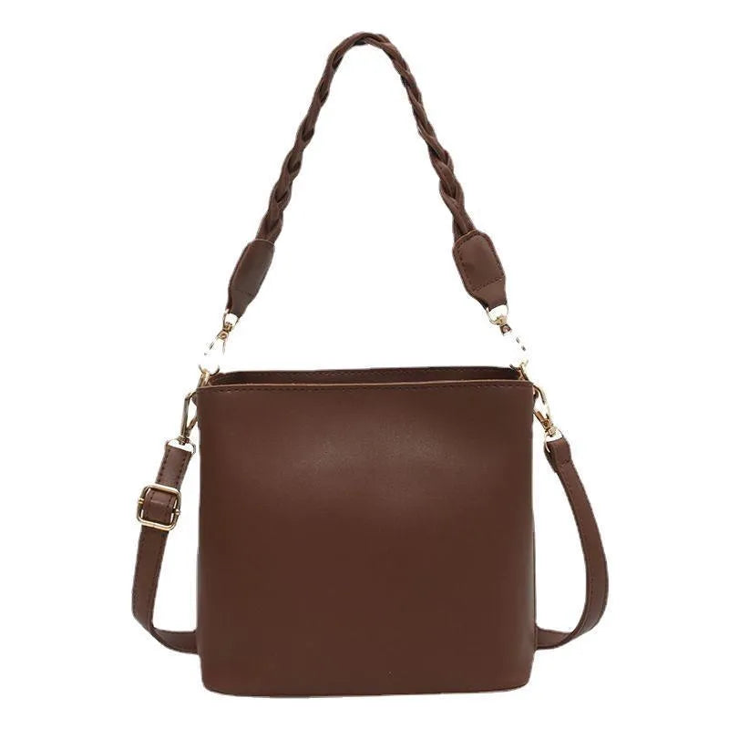 Retro-inspired woven PU crossbody bucket bag in khaki colour showing androgynous design details