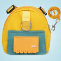 Blue adjustable dog backpack harness with storage pockets and a built-in tow rope laid flat.