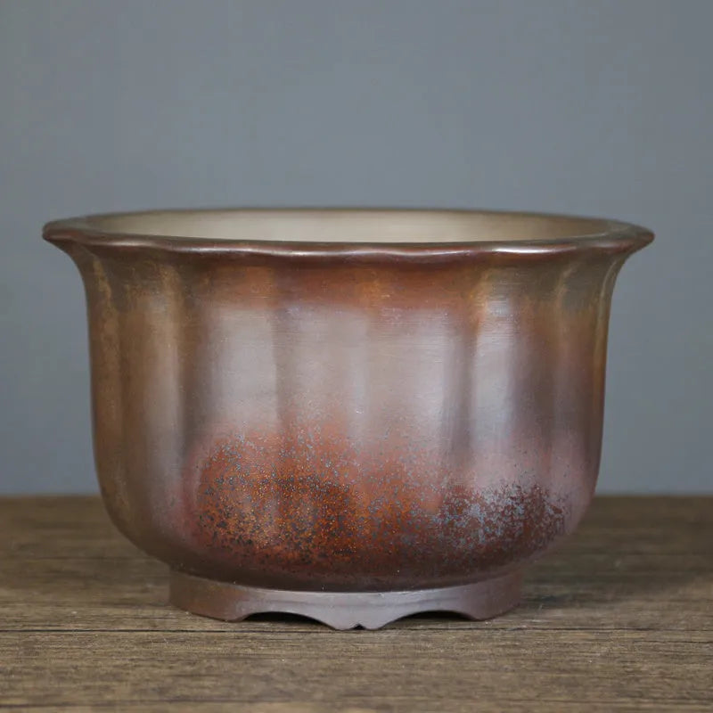 Indoor antique carved ceramic flower pot in purple sand with wood burning finish