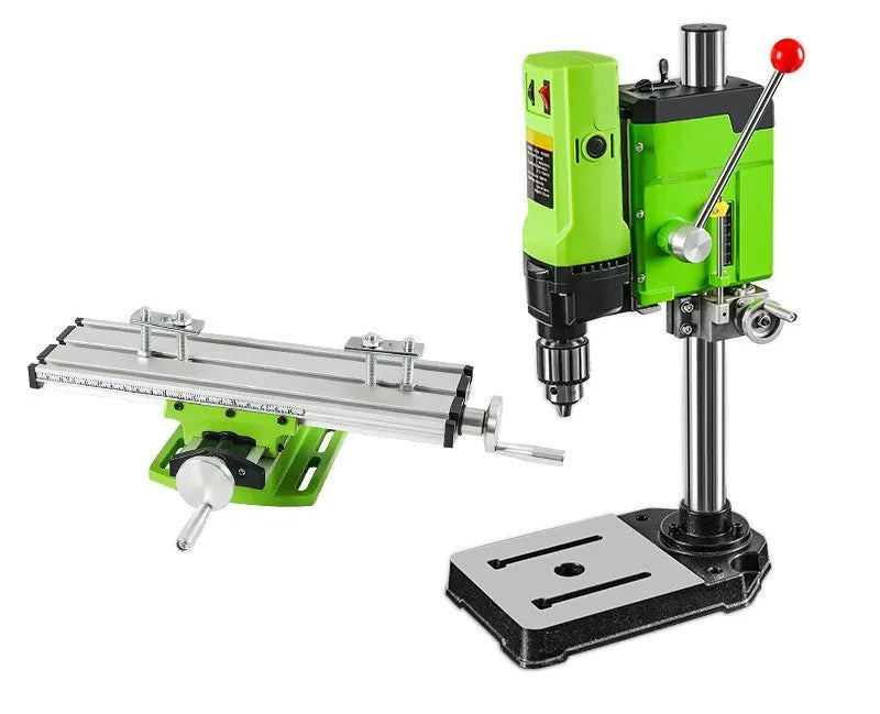 Mini bench drill and milling machine with included 1050W drill and metal bench pliers on a workbench.