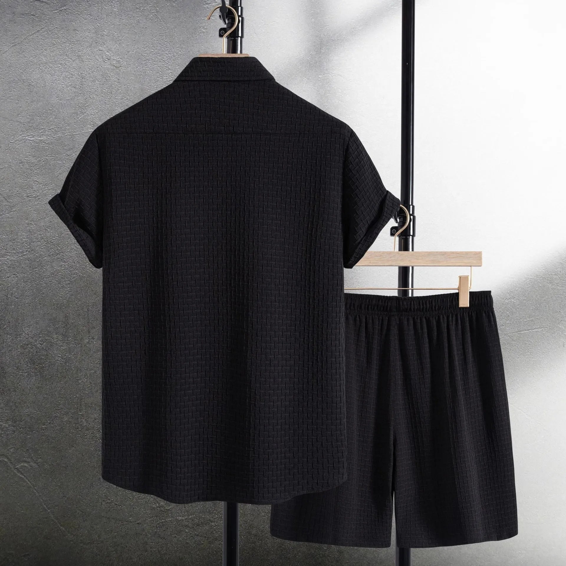Men's black casual summer shirt and shorts suit with short sleeves on hanger