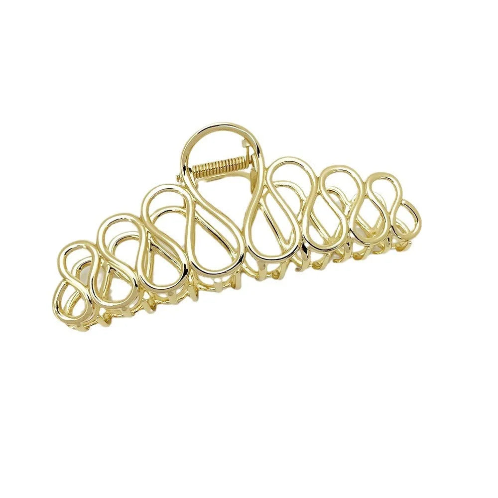 Women's minimalist hair clip in gold or silver with geometric tassel decoration