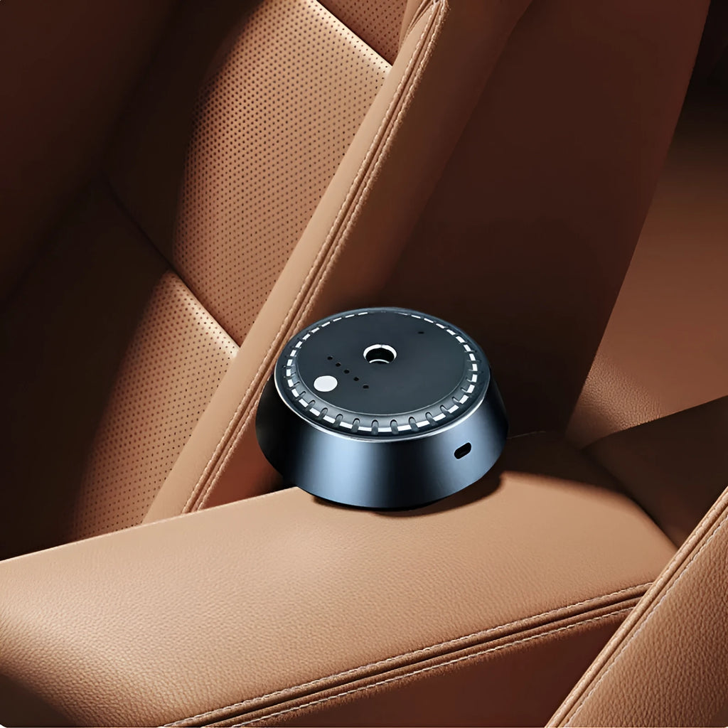 Black metal car aroma diffuser measuring 9cm by 4.5cm with USB connection