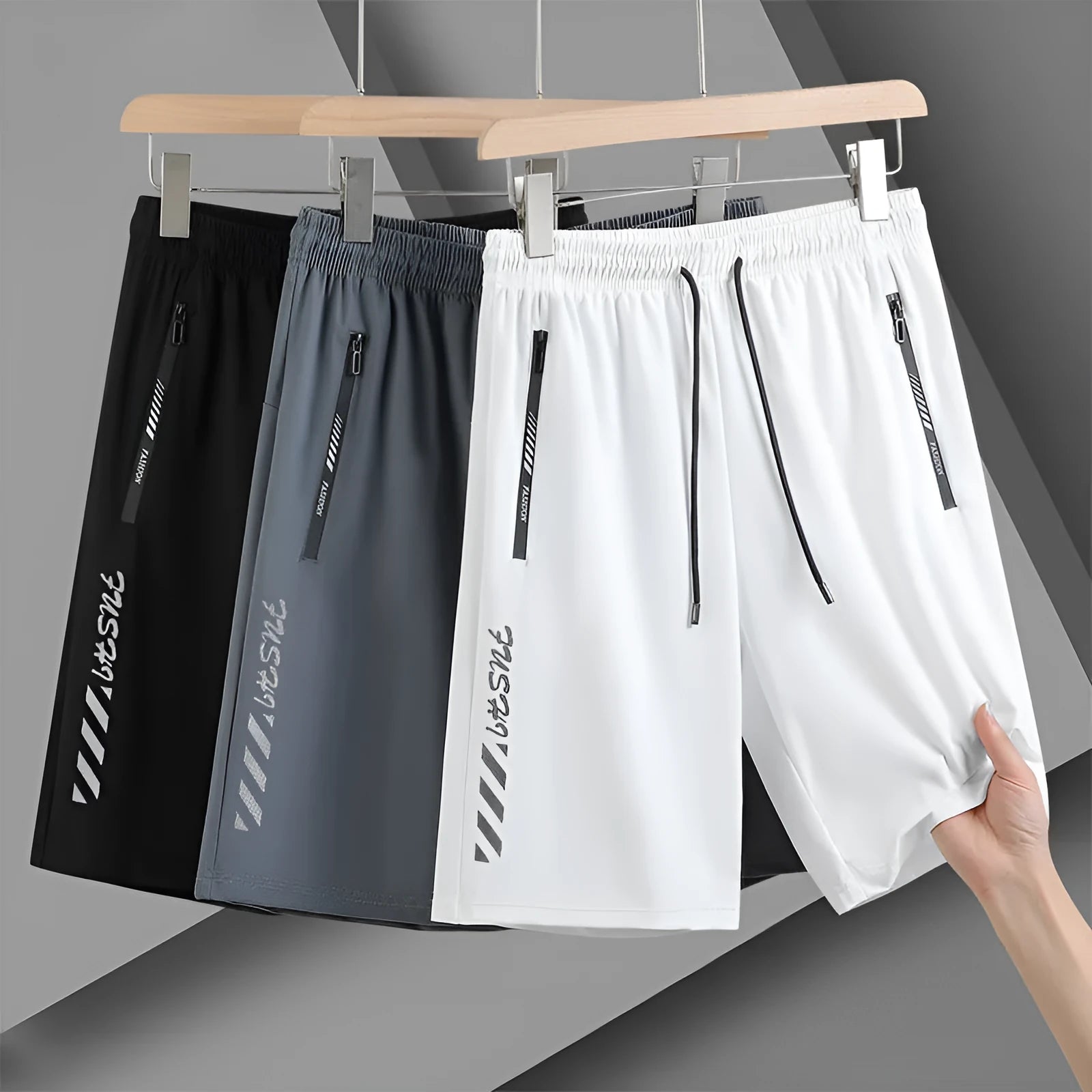 Man wearing black loose-fit quick-drying nylon sports shorts for summer activity.