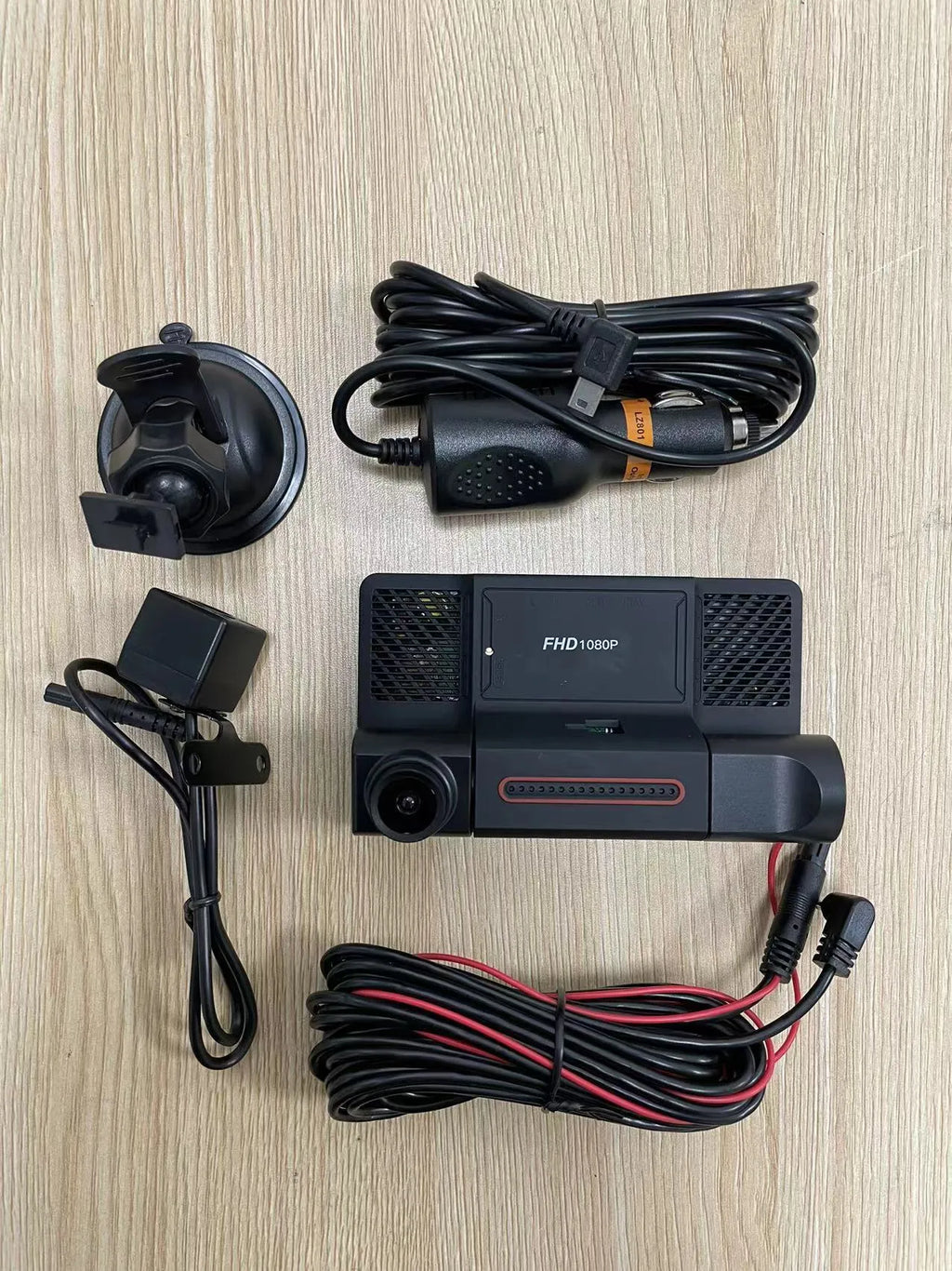 Three lens dashcam with 4 inch touch screen showing front rear and interior recording angles black plastic