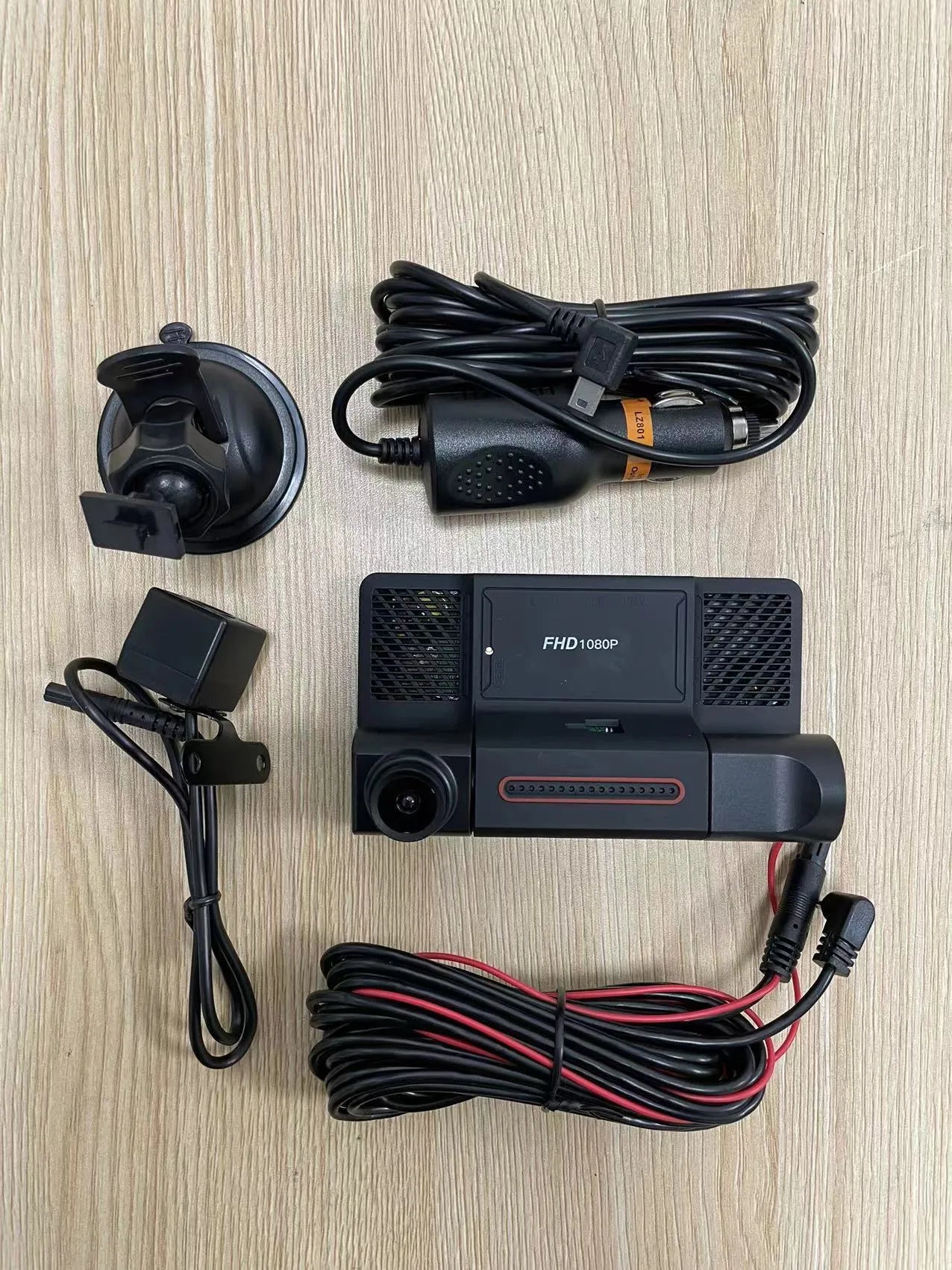 Three lens dashcam with 4 inch touch screen showing front rear and interior recording angles black plastic