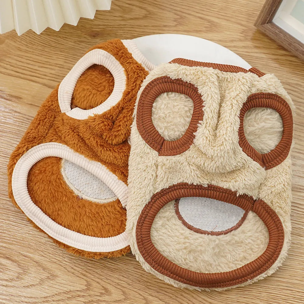 Fleece-lined warm polyester dog coat in cream with bear ears, lying flat showing size tag