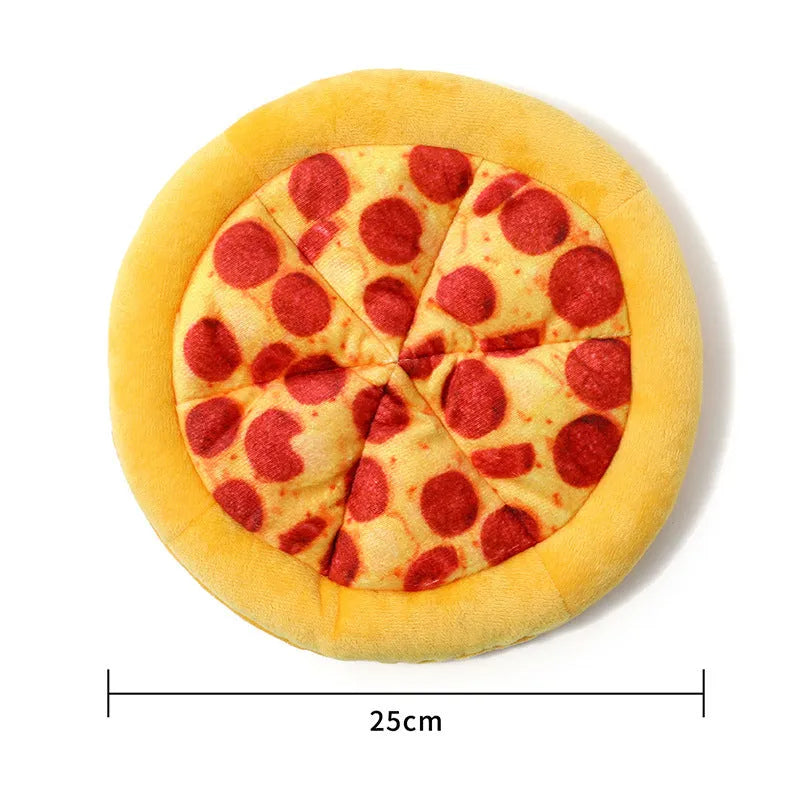 Yellow pizza slice shaped plush squeaky dog chew toy on a white background