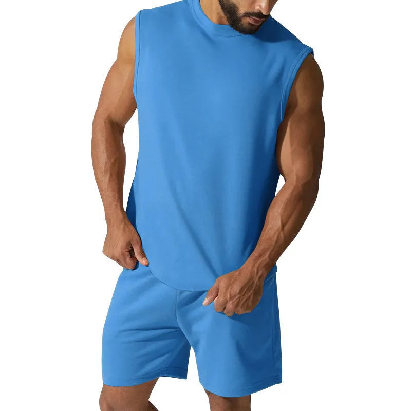 Men's sleeveless cotton blend sports suit showing top and shorts in a solid colour.