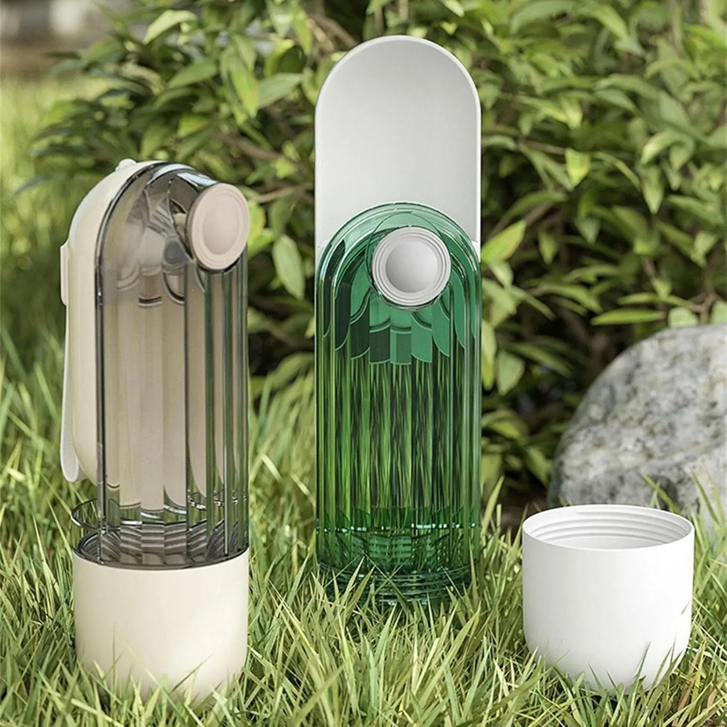 Beige foldable dog water bottle with integrated food container, shown with press-button tray.