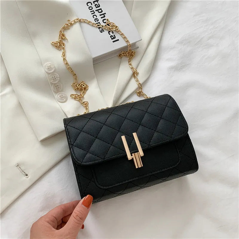 Women's diamond lattice chain crossbody bag in black, white, or green with adjustable strap