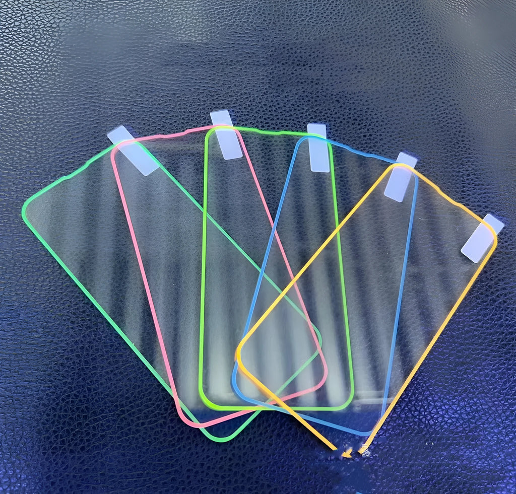 Fluorescent luminous tempered glass screen protector for iPhone on a phone.