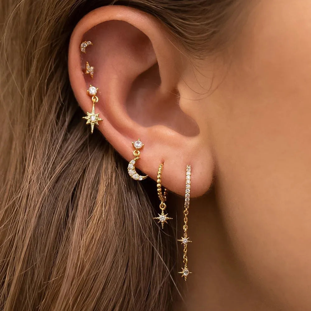 Gold electroplated chain tassel earrings set with six pieces including zircon stud accents