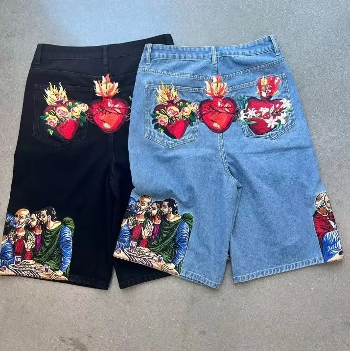 Blue men's cotton shorts with a Jesus design printed on the back pocket, showing tapered leg.