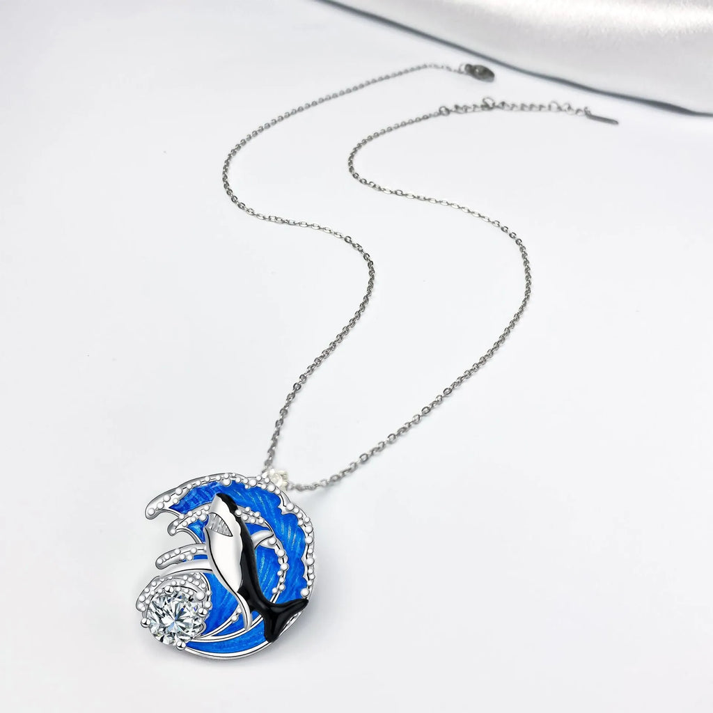 Silver shark pendant necklace on a cross chain, adjustable between 41cm and 50cm.