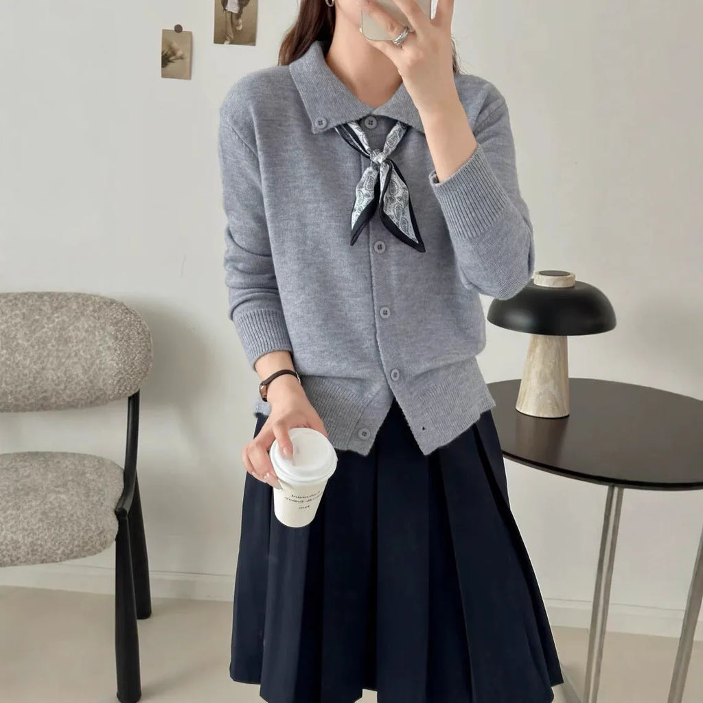 Milky white lazy fashion lapel scarf cardigan sweater with splicing detail and long sleeves.