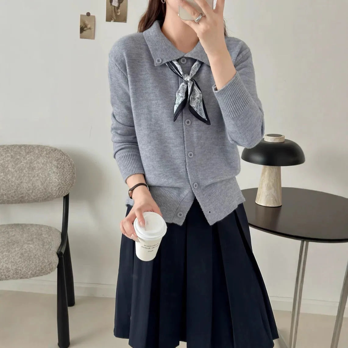 Milky white lazy fashion lapel scarf cardigan sweater with splicing detail and long sleeves.