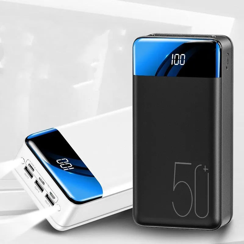 Black or white 50000mAh power bank with three USB output ports showing size scale