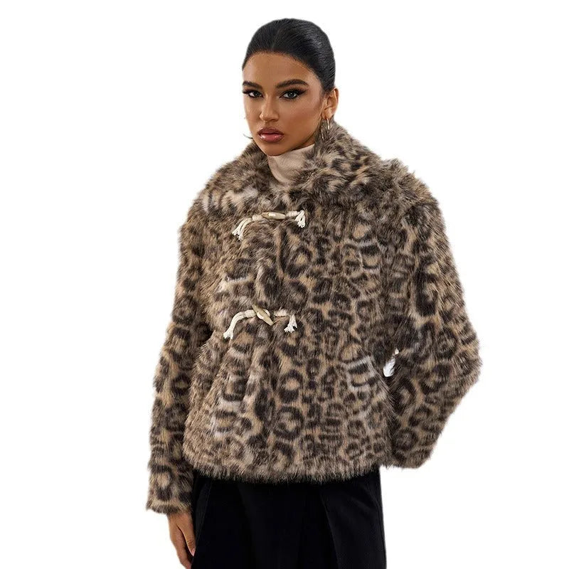 Women's leopard print polyester coat with buckle lapel detail showing regular sleeves and mid-length design