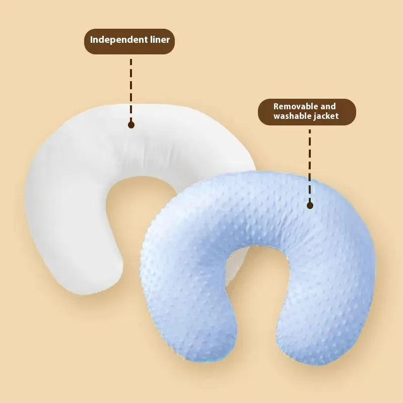 Pink nursing pillow for baby feeding support and spill prevention.
