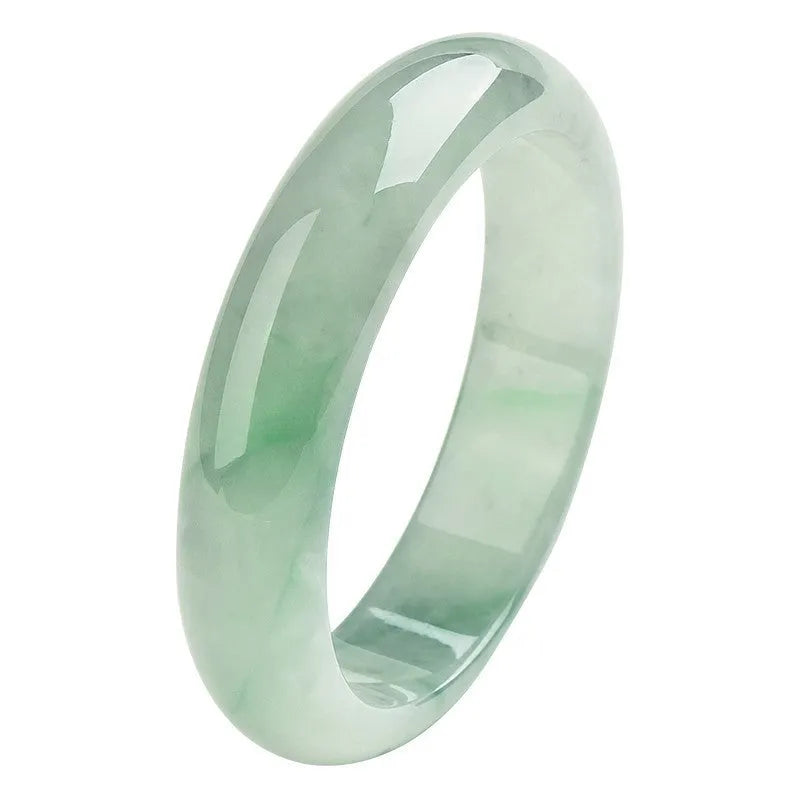 Light green jade bracelet with smooth surface showing natural stone texture