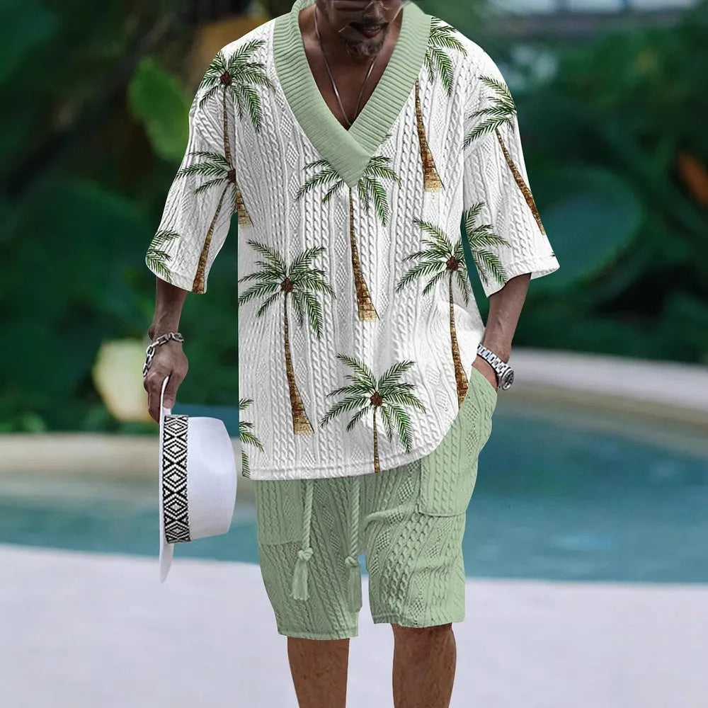 Man wearing a loose blue short sleeve suit top and matching shorts for casual summer wear.