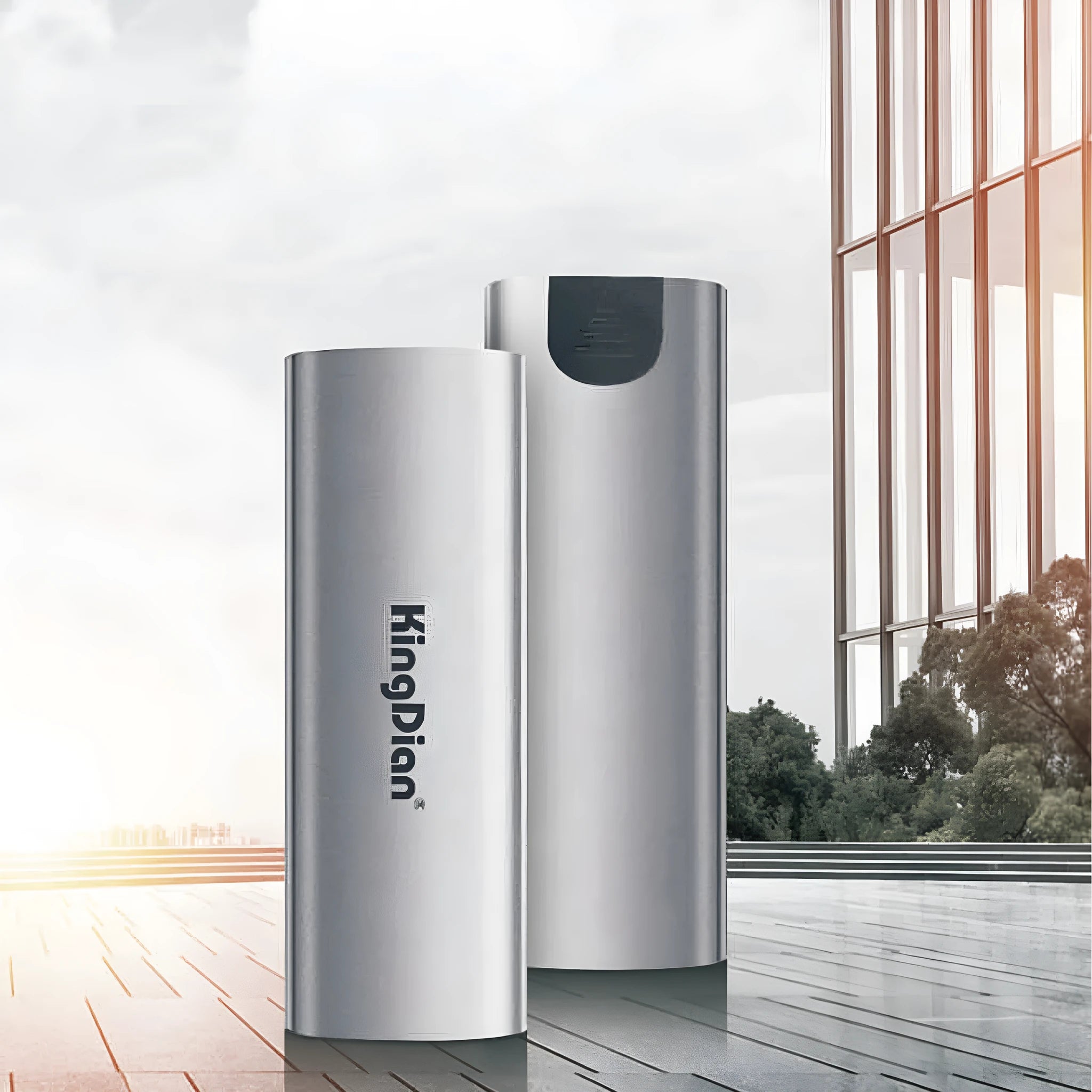 Grey aluminium portable SSD hard drive with USB 3.0 connector for mobile phones and computers.