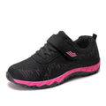 Women's grey purple breathable mesh shoes with a velcro strap and wedge heel on a composite sole.