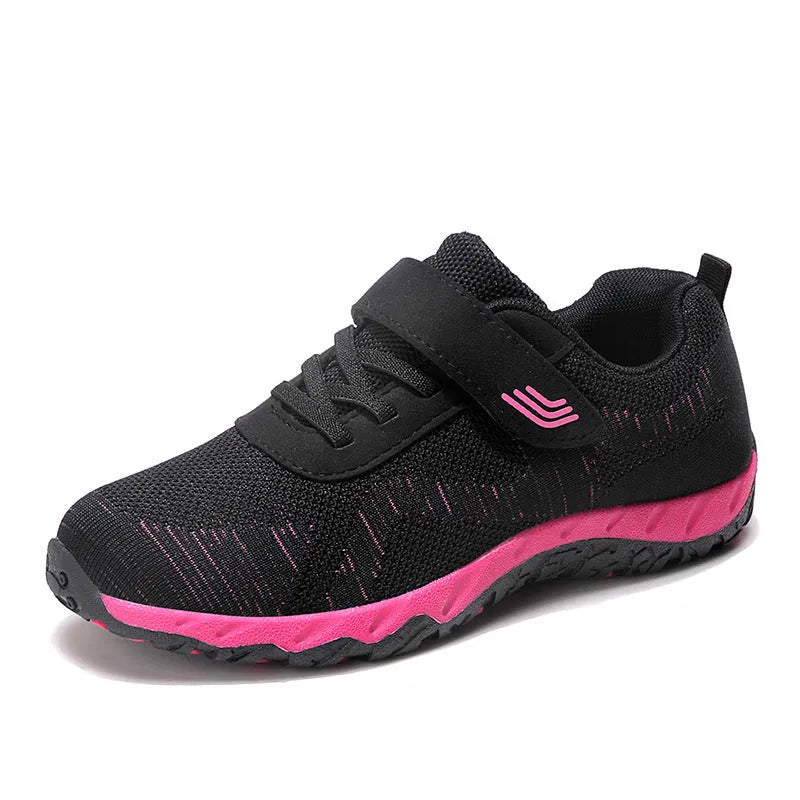 Women's grey purple breathable mesh shoes with a velcro strap and wedge heel on a composite sole.