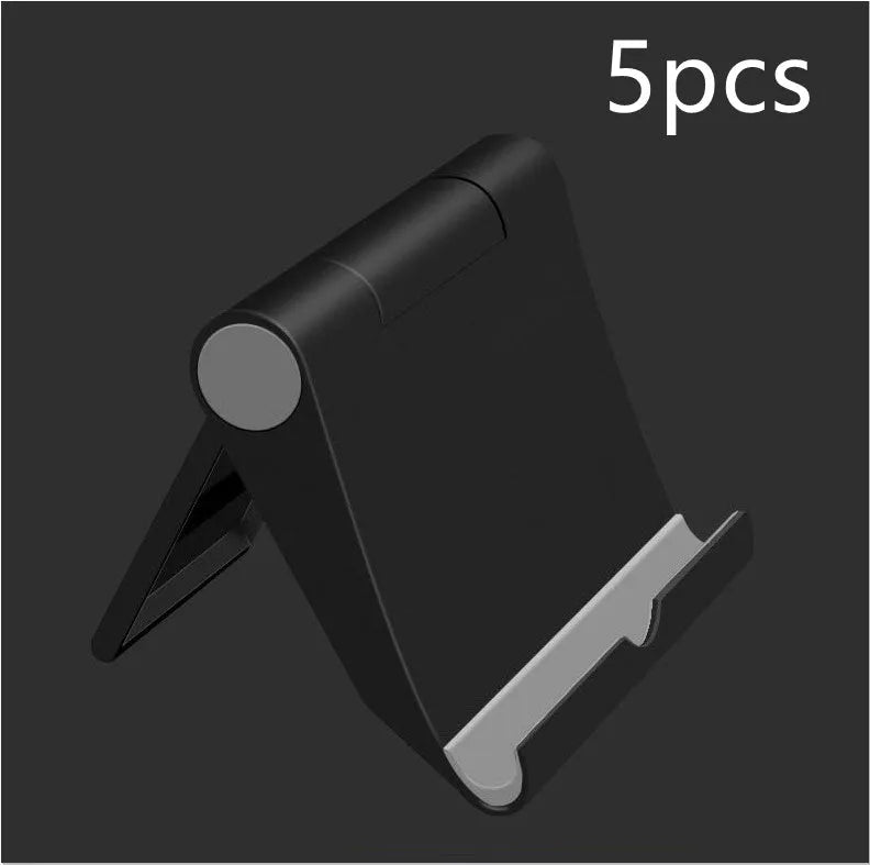 Black PE folding stand holding a mobile phone at an angle on a wooden desk.