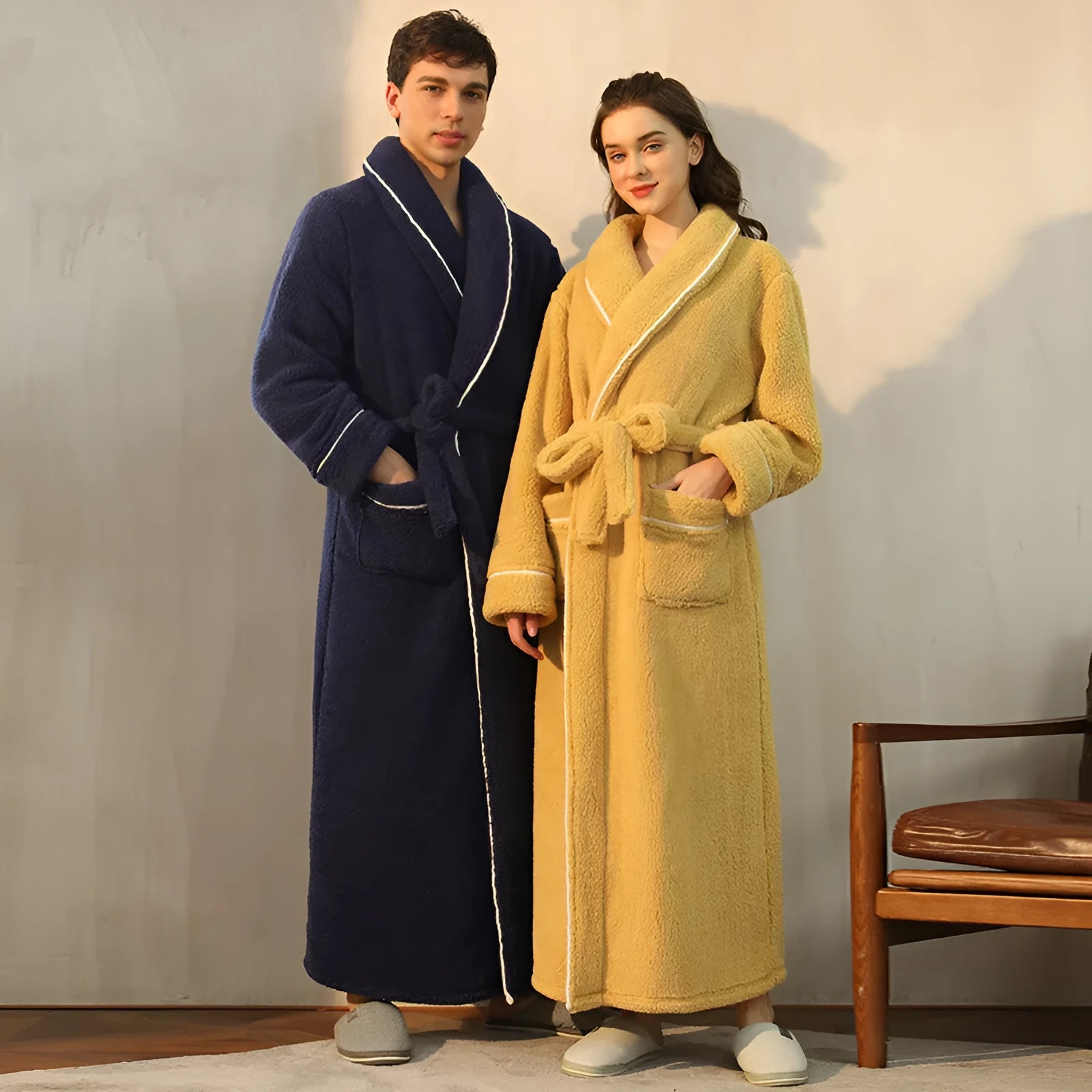 Man and woman wearing a matching thick flannel couple's bathrobe set in a winter colour.