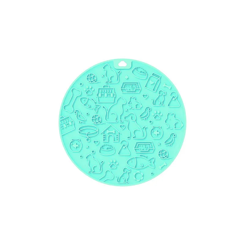 Round silicone pet licking mat with suction cup in blue colour on a floor