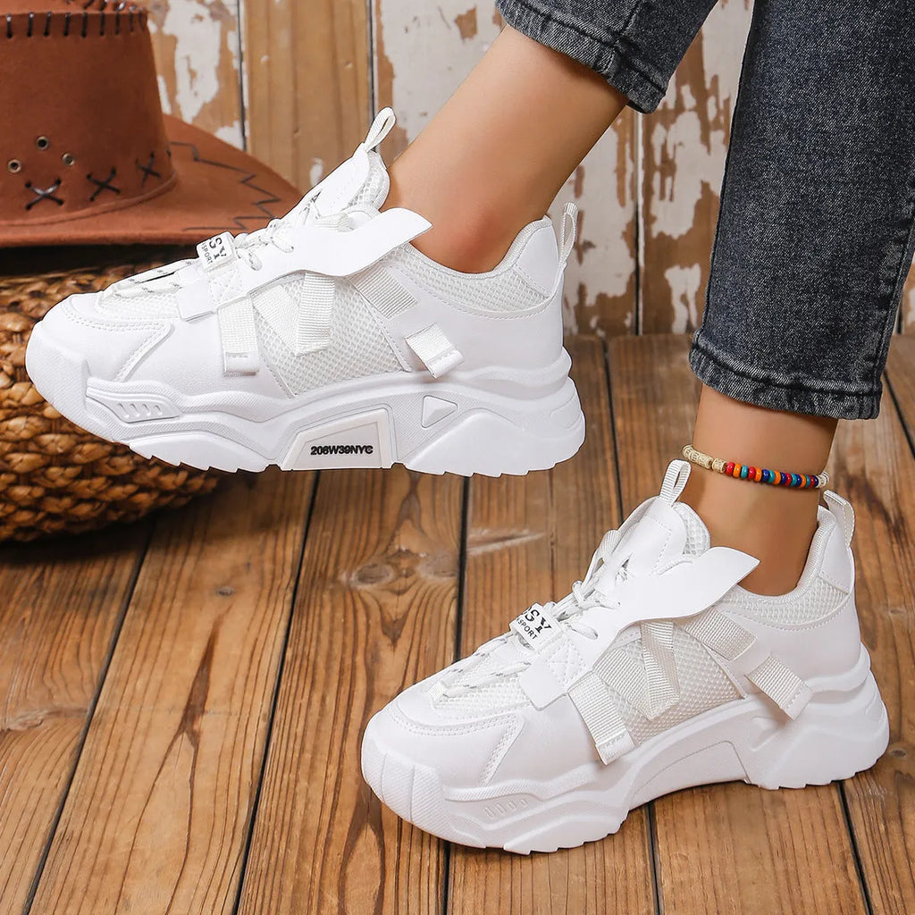 Women's purple platform mesh sports trainer with lace-up front on a white background.