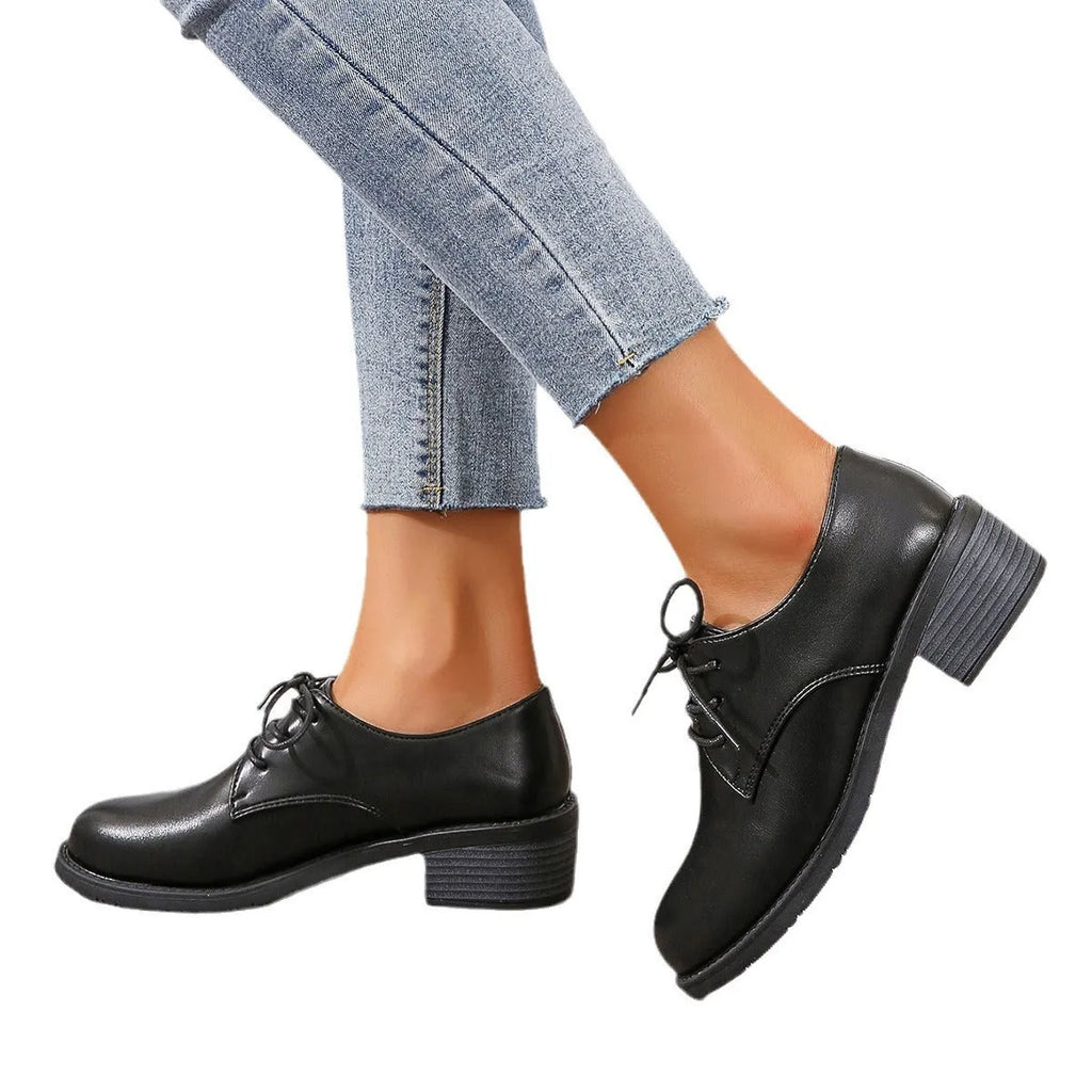 Black women's professional work shoes with thick chunky heel and low-top design
