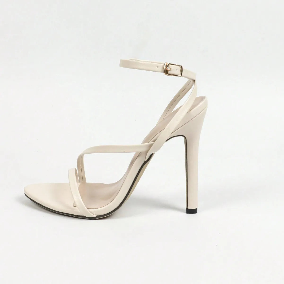 Women's gold open toe high heel sandals with cross ankle strap on a white background