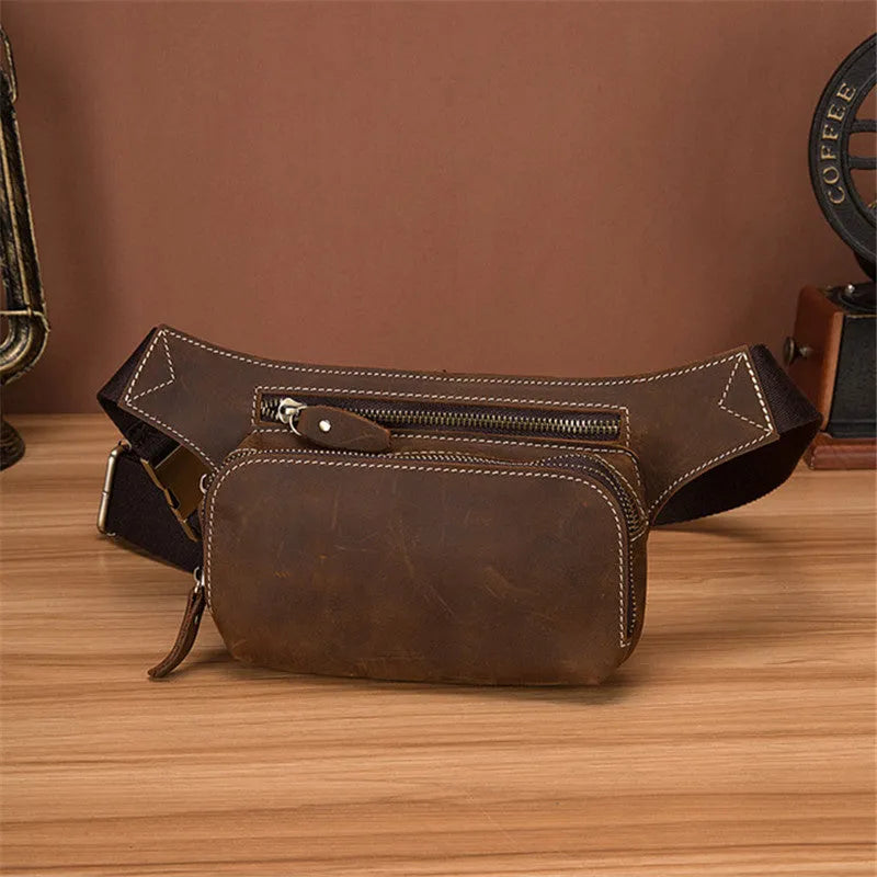 Brown cowhide men's sports waist bag with pull closure showing internal phone compartment