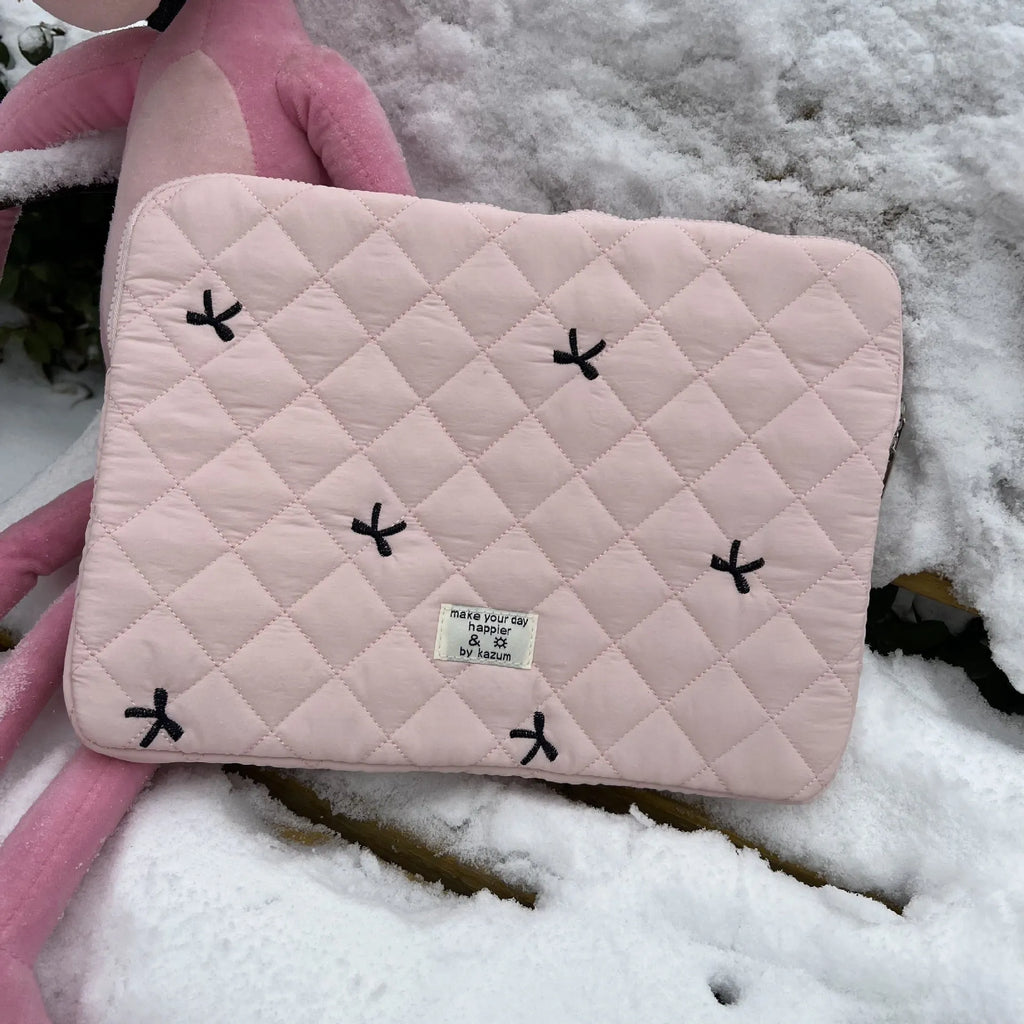 Cute rhombus embroidered bow laptop sleeve in light blue colour, zipper closure.