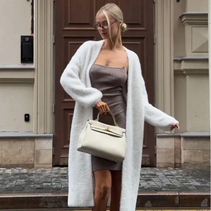 White women's knitted cardigan jacket with extended length and loose fit